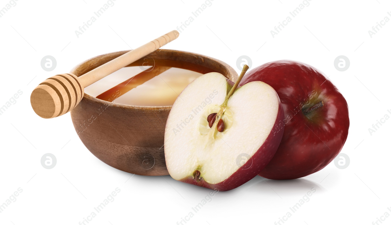 Image of Honey in bowl and apples isolated on white