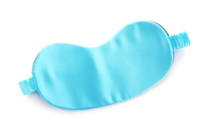 Photo of Turquoise sleeping eye mask isolated on white, top view. Bedtime