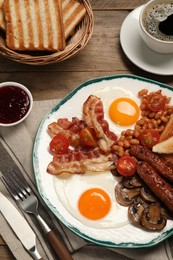 Photo of Traditional English breakfast served on table, flat lay