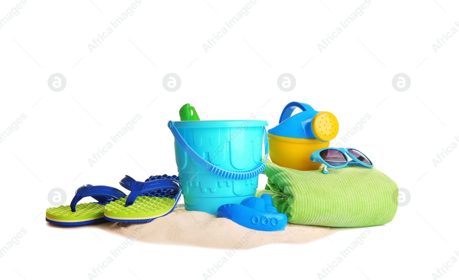 Photo of Set of plastic beach toys, accessories and pile of sand on white background