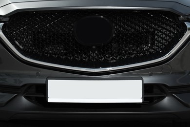 Car with vehicle registration plate, closeup view