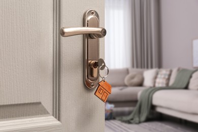 Image of Closeup view of door with key open in living room 