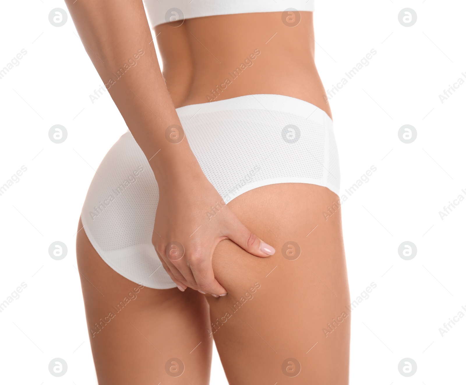 Photo of Closeup view of slim woman in underwear on white background. Cellulite problem concept