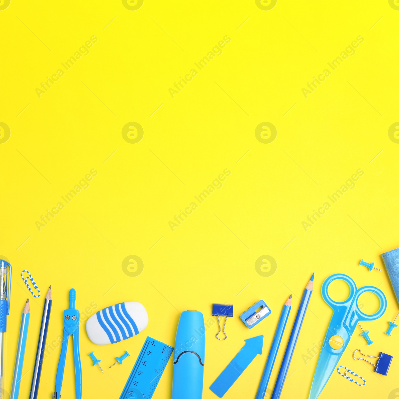 Image of Flat lay composition with different school stationery on yellow background. Space for text
