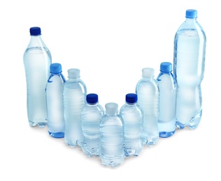 Photo of Set of different plastic bottles with water on white background