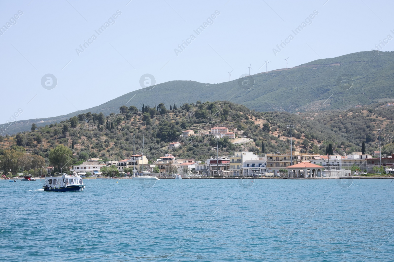 Photo of Beautiful view of sea with boat and coastal city