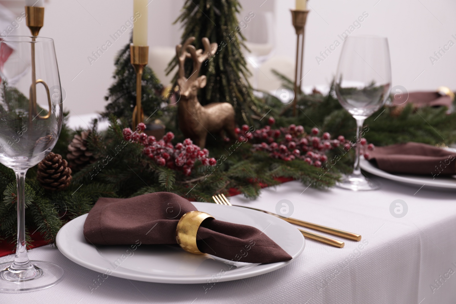 Photo of Beautiful table setting with Christmas decor indoors