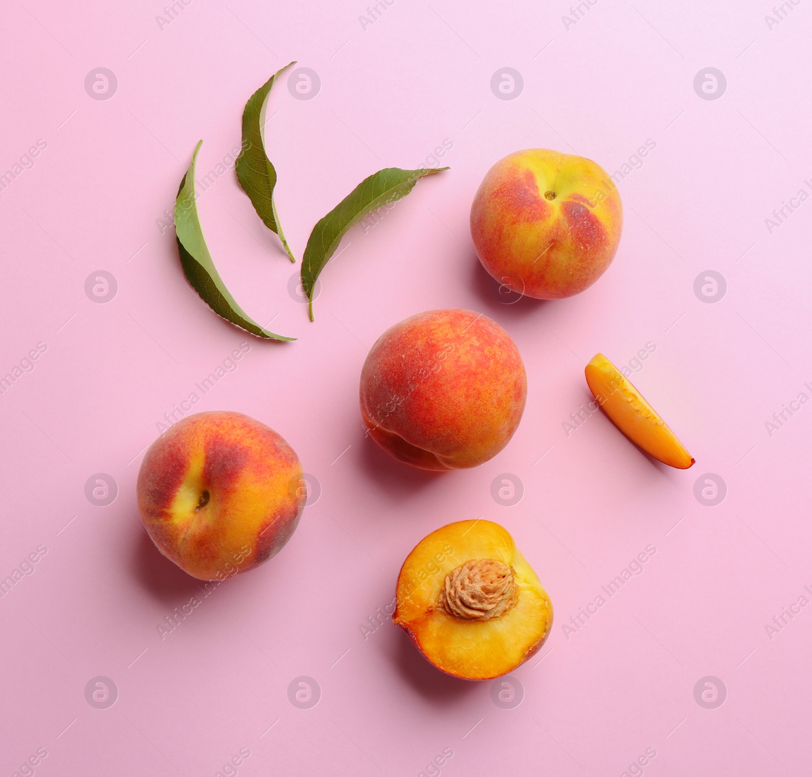 Photo of Flat lay composition with fresh peaches on pink background