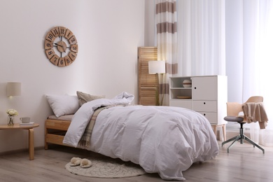 Photo of Modern teenager room interior with comfortable bed