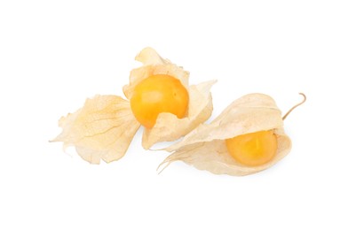 Photo of Ripe physalis fruits with calyxes isolated on white, top view