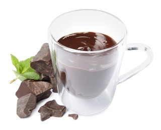 Photo of Glass cup of delicious hot chocolate, chunks and fresh mint on white background