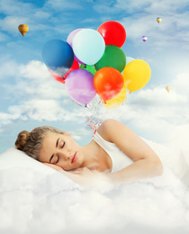 Image of Young beautiful woman sleeping in bed. Bright air balloons in blue cloudy sky - sweet dreams