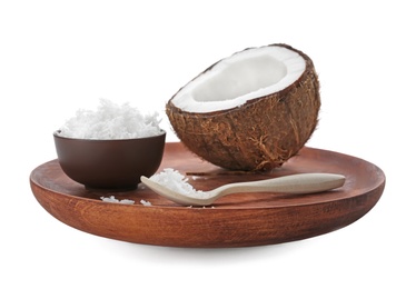 Composition with fresh coconut flakes on white background