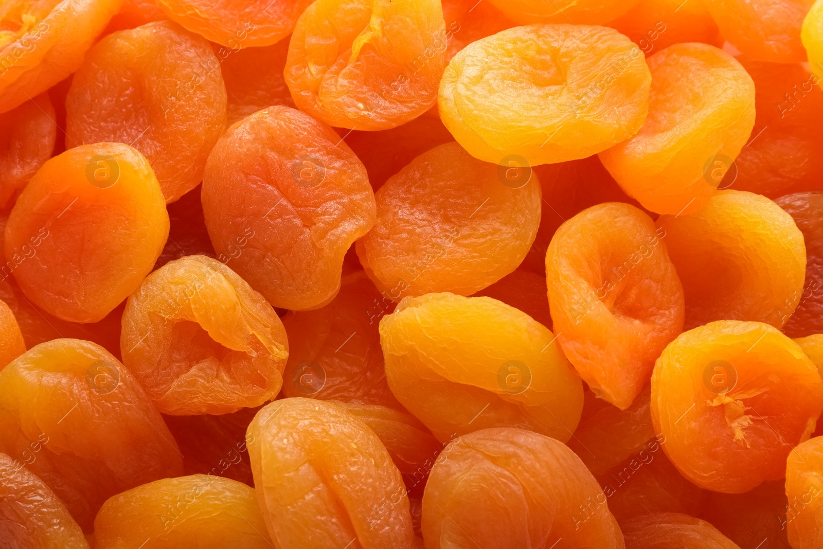 Photo of Tasty apricots as background, top view. Dried fruit as healthy food