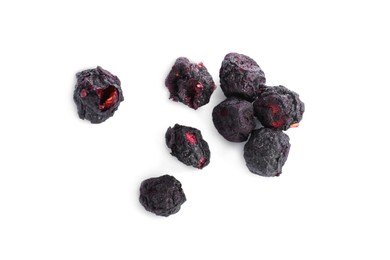 Photo of Pilefreeze dried blueberries on white background, top view