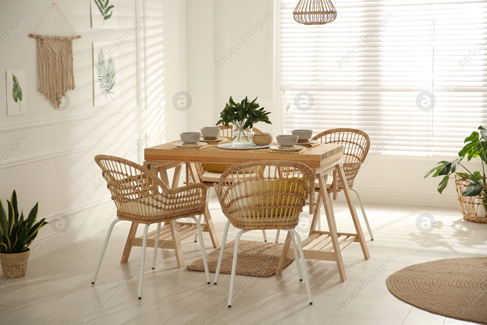 Photo of Stylish wooden dining table and chairs in room. Interior design