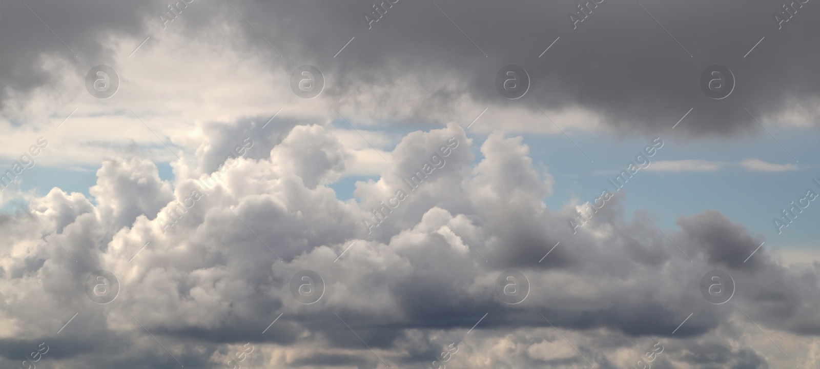 Image of Beautiful sky with fluffy white clouds, banner design