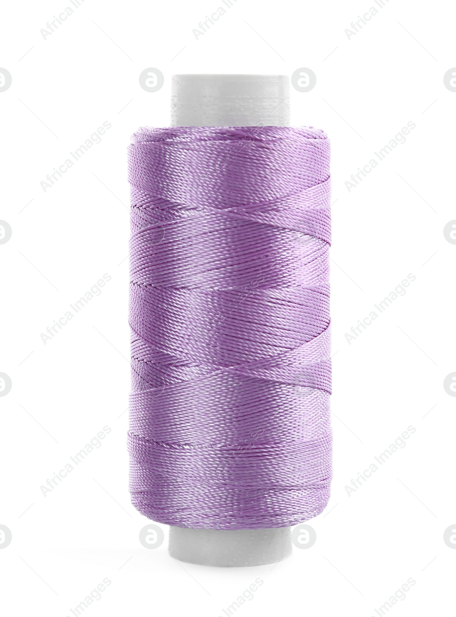 Photo of Spool of violet sewing thread isolated on white