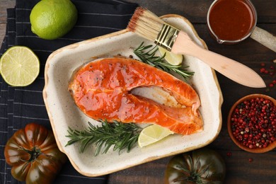 Fresh marinade, fish and other products on wooden table, flat lay