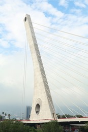 Photo of Beautiful view of modern bridge against blue cloudy sky