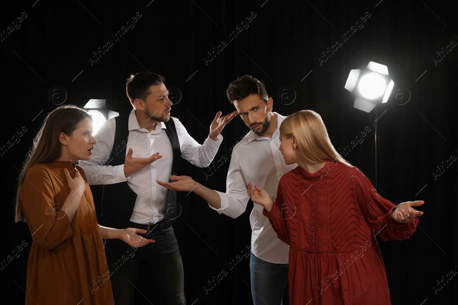 Photo of Professional actors rehearsing on stage in theatre