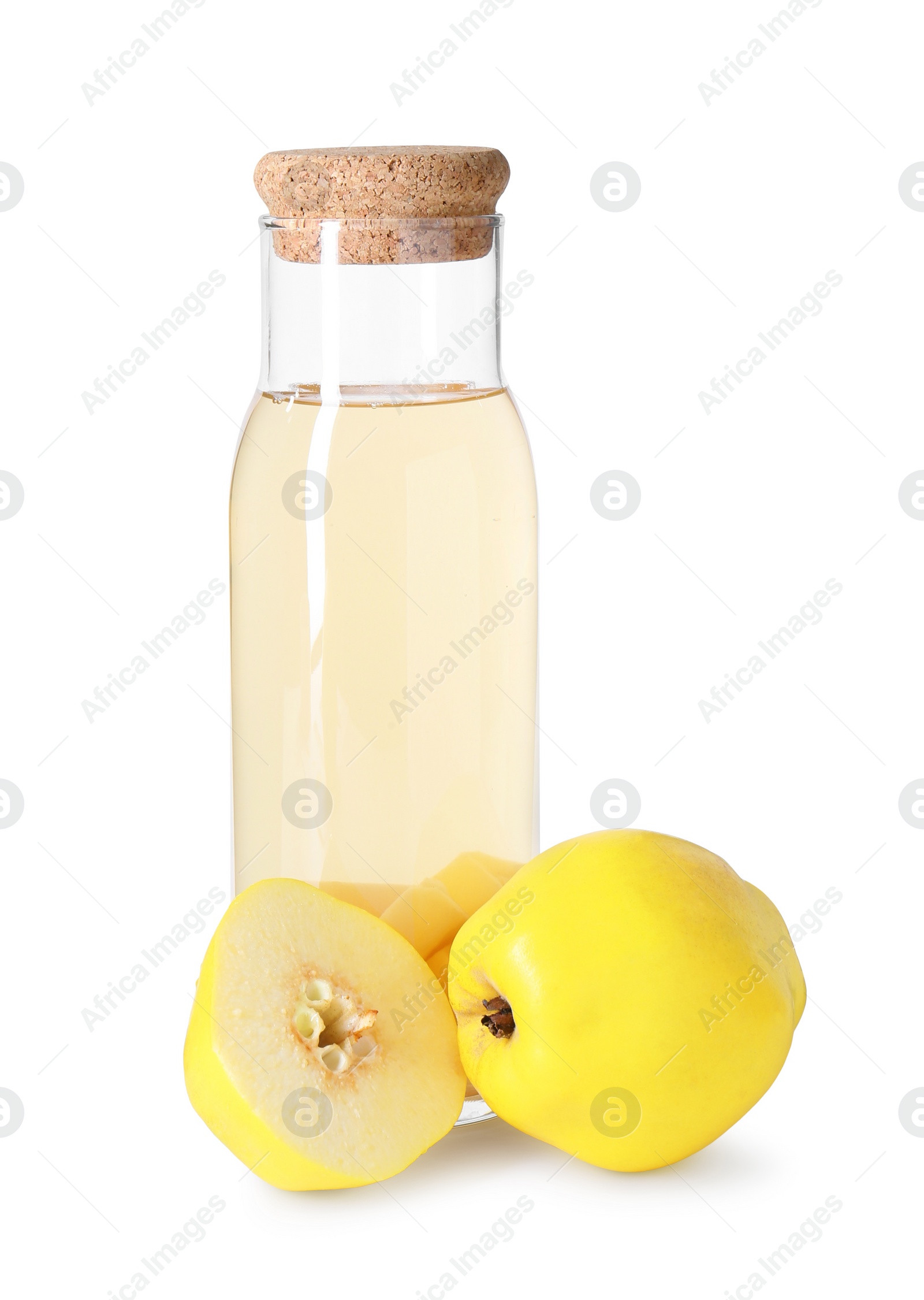 Photo of Tasty quince drink in glass carafe and fresh cut fruits isolated on white