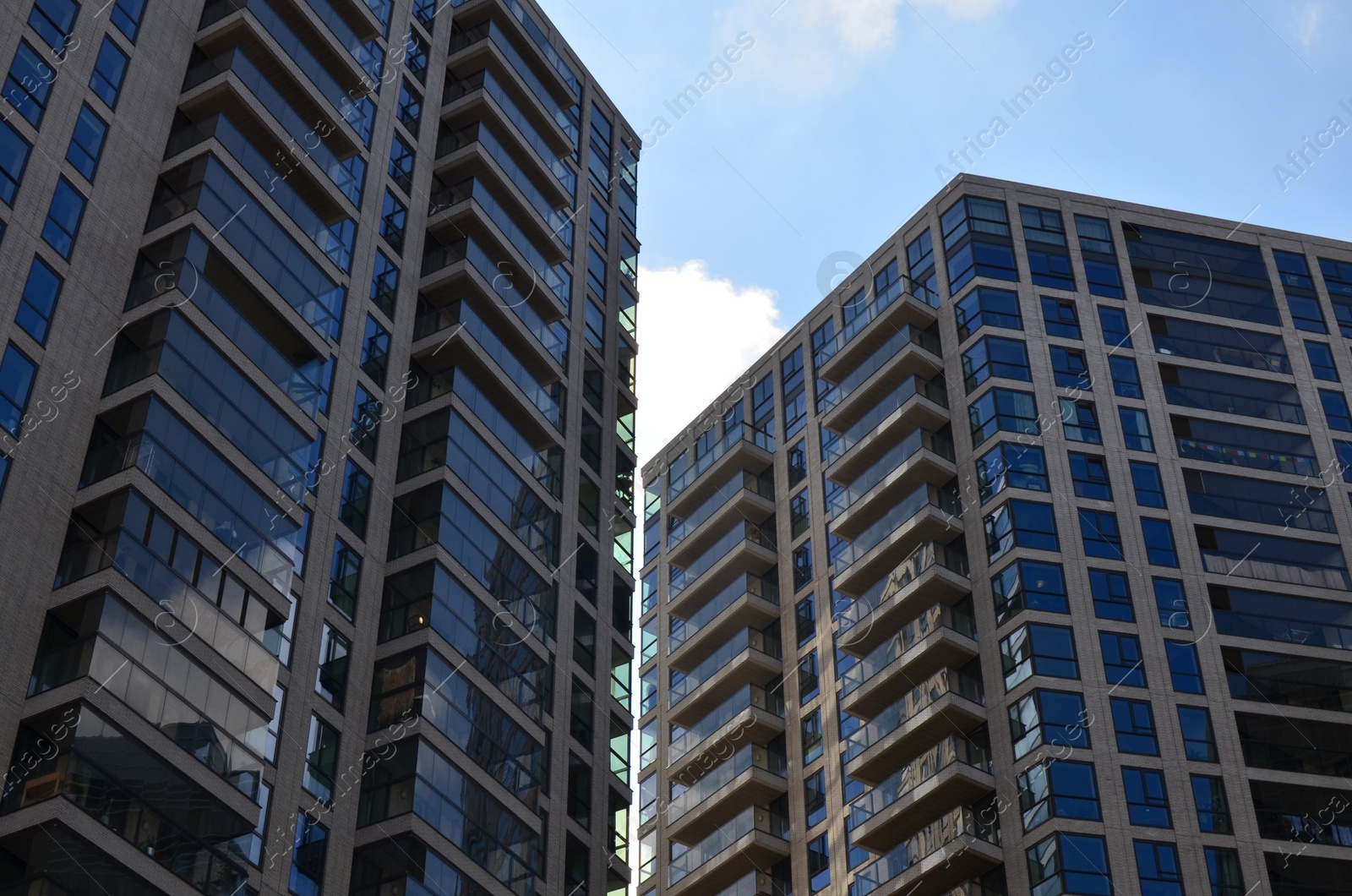 Photo of Exterior of beautiful buildings against blue sky, low angle view