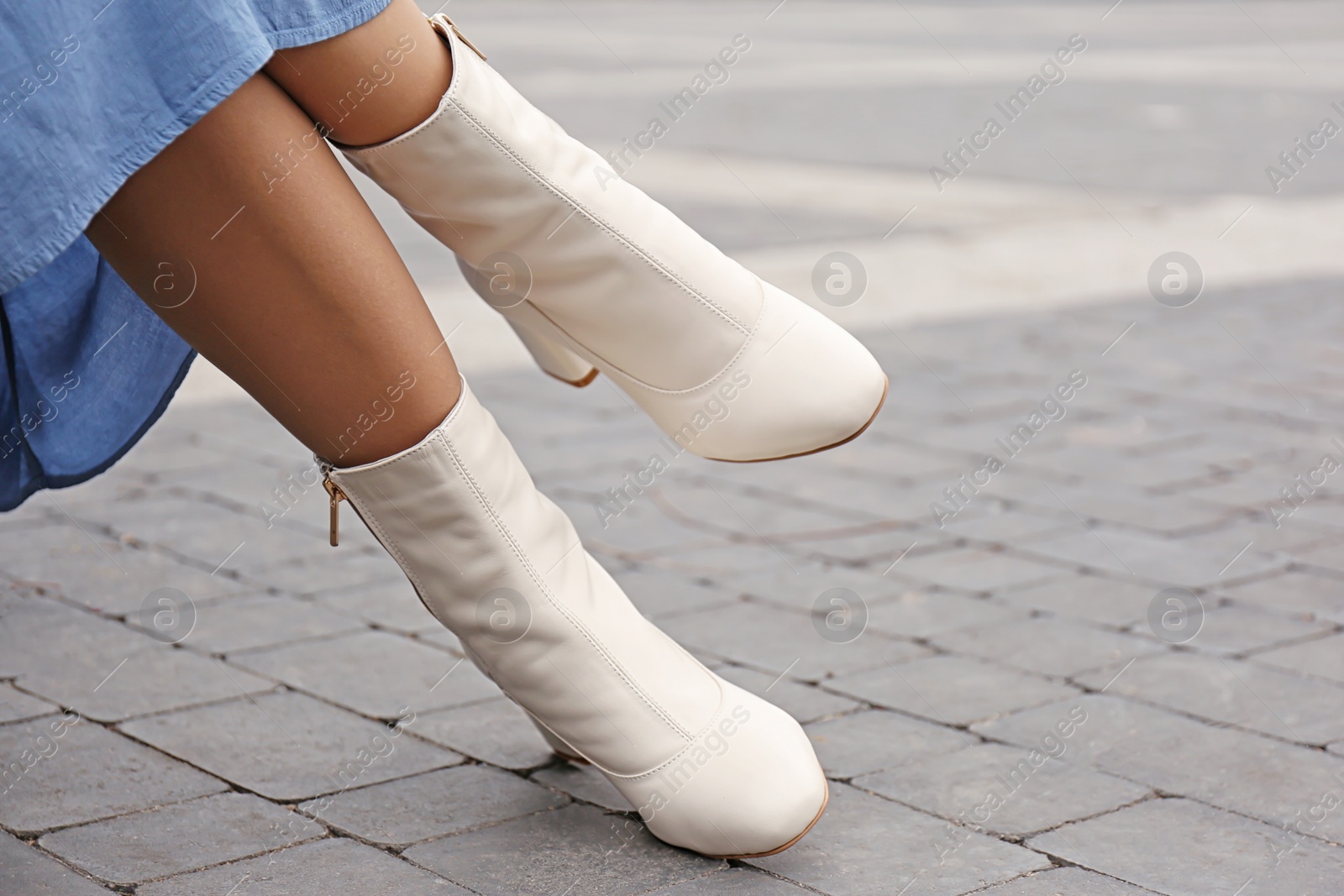 Photo of Woman wearing stylish leather shoes outdoors, closeup