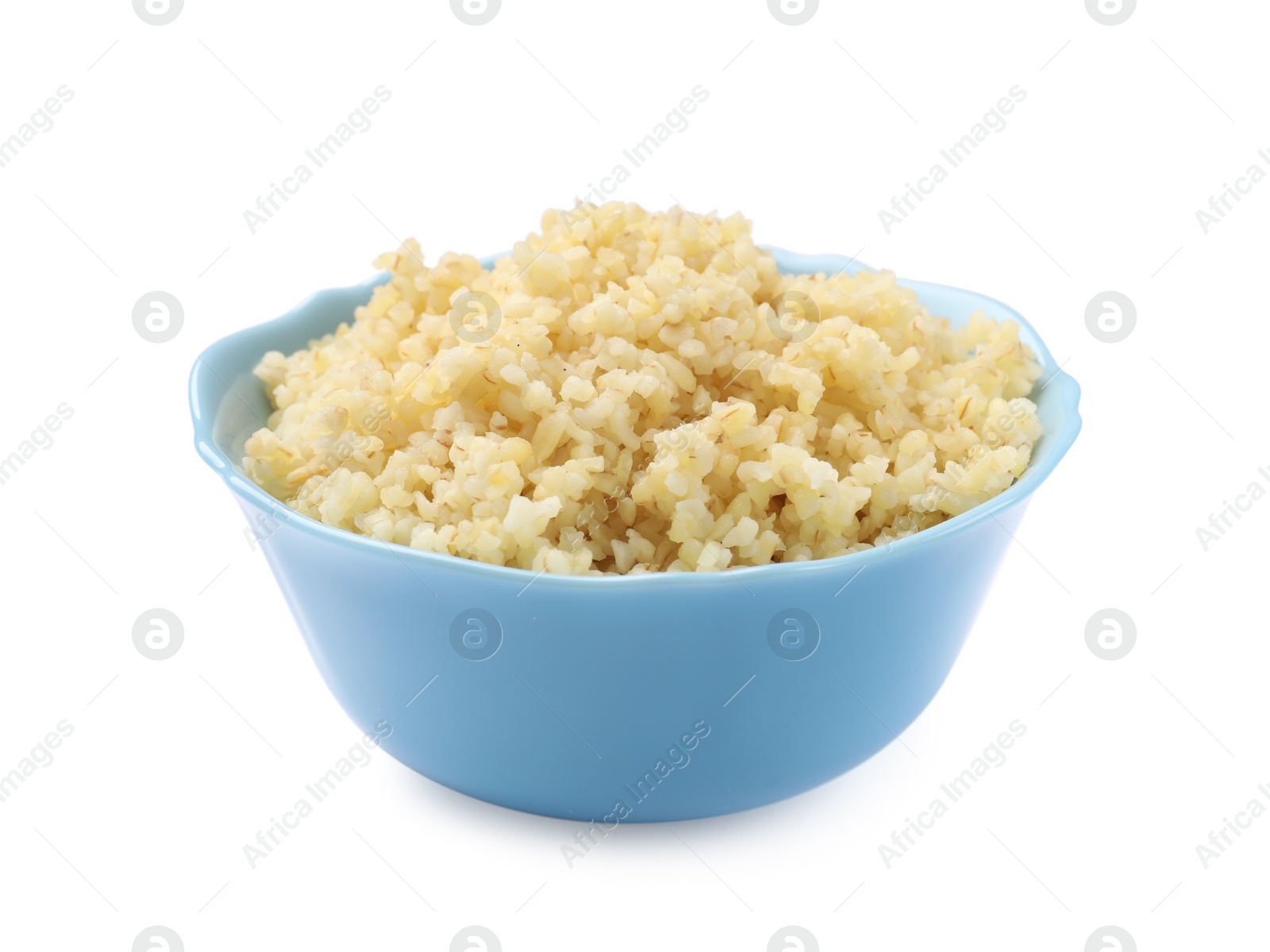 Photo of Delicious bulgur in bowl isolated on white