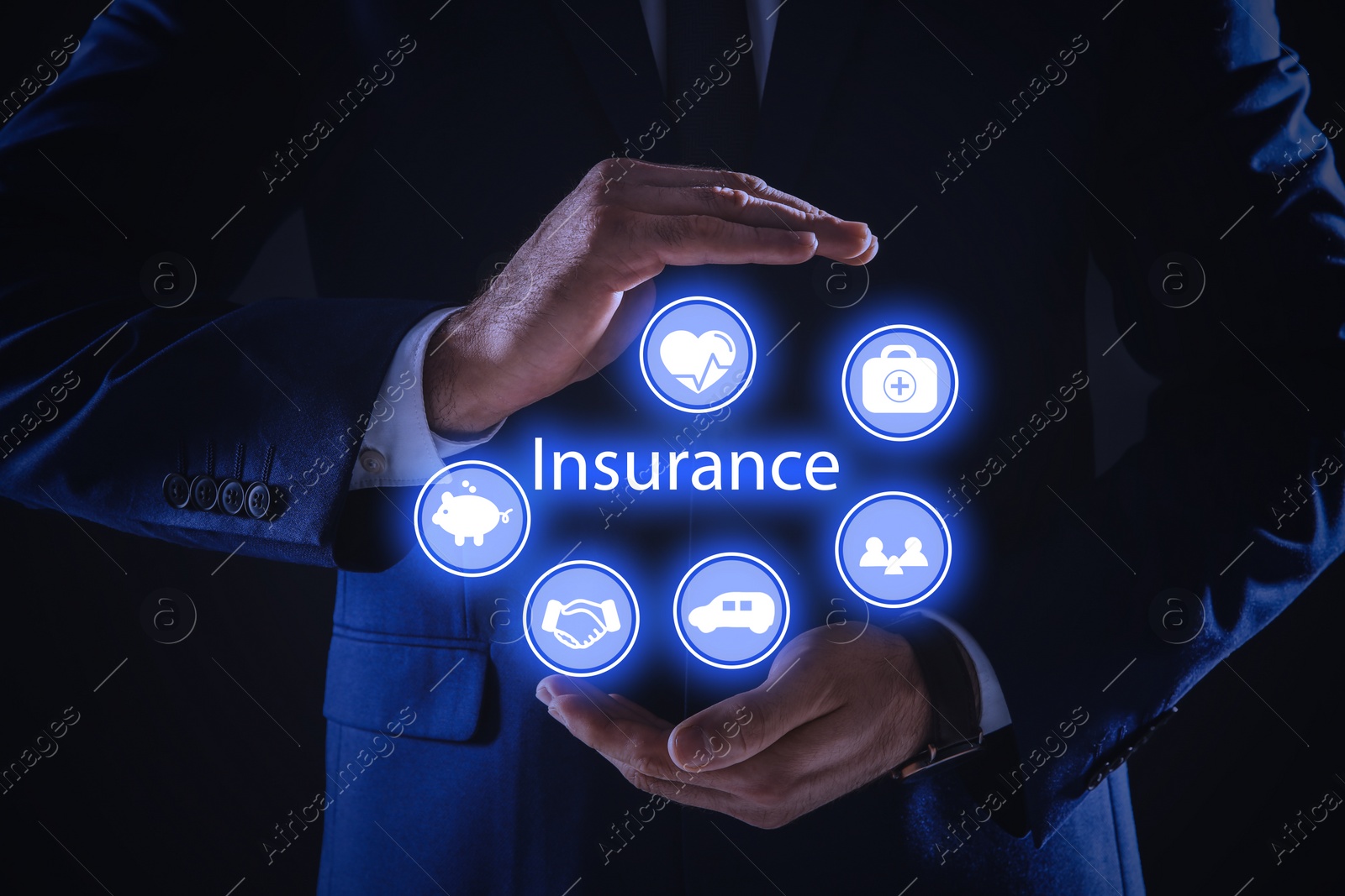 Image of Businessman holding different icons on dark background, closeup. Insurance concept