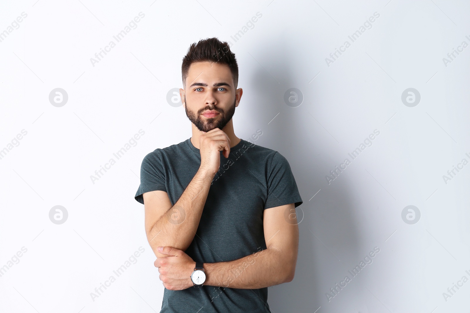 Photo of Portrait of handsome confident man isolated on white