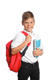 Little boy with backpack and notebooks on white background. Stationery for school
