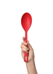 Woman holding serving spoon on white background. Kitchen utensils