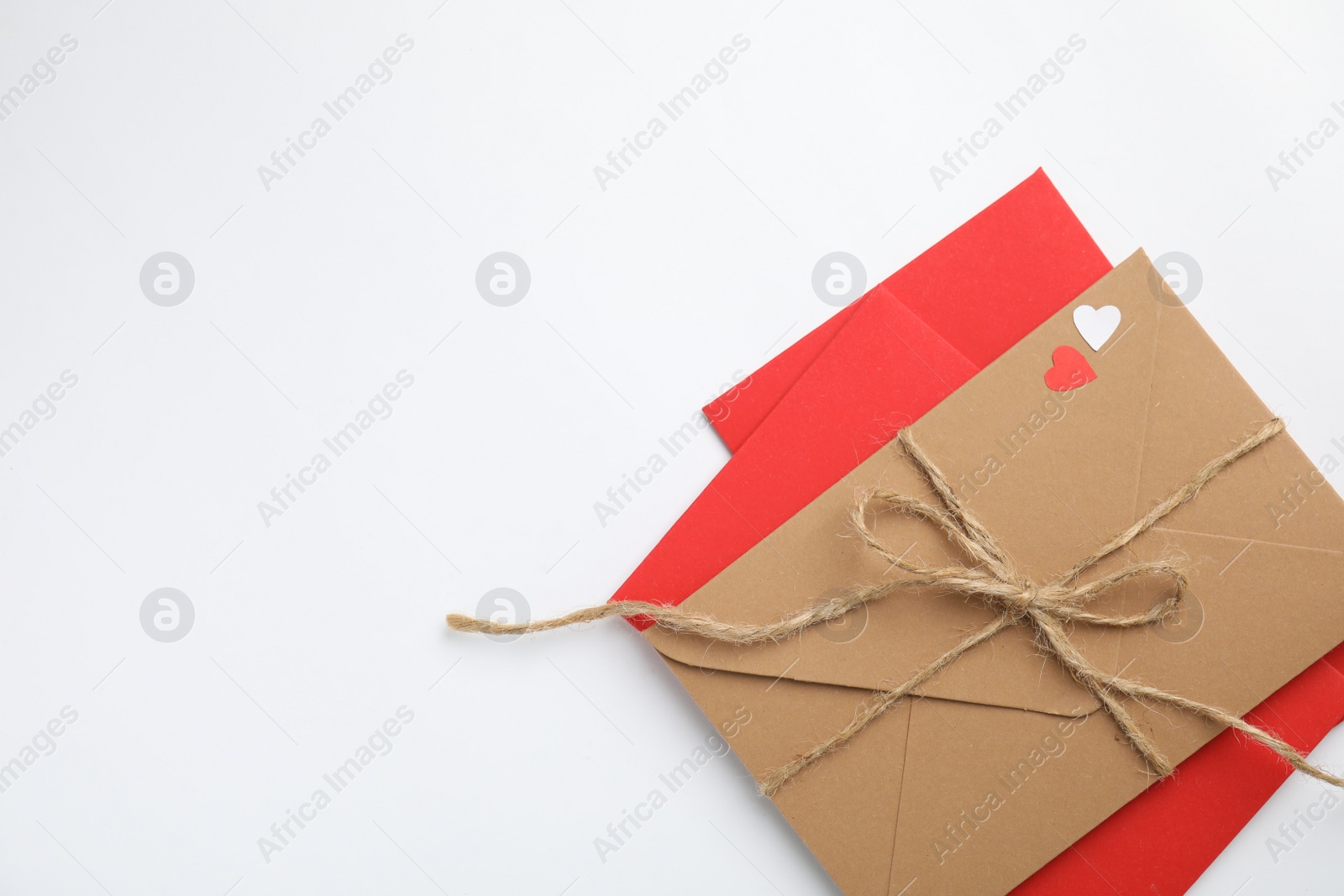 Photo of Envelopes on white background, top view with space for text. Love letters