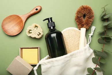 Flat lay composition with eco friendly products on green background