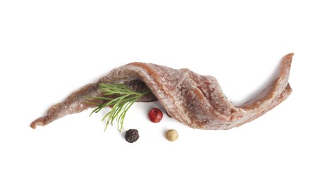Photo of Delicious anchovy fillet, dill and spices on white background, top view
