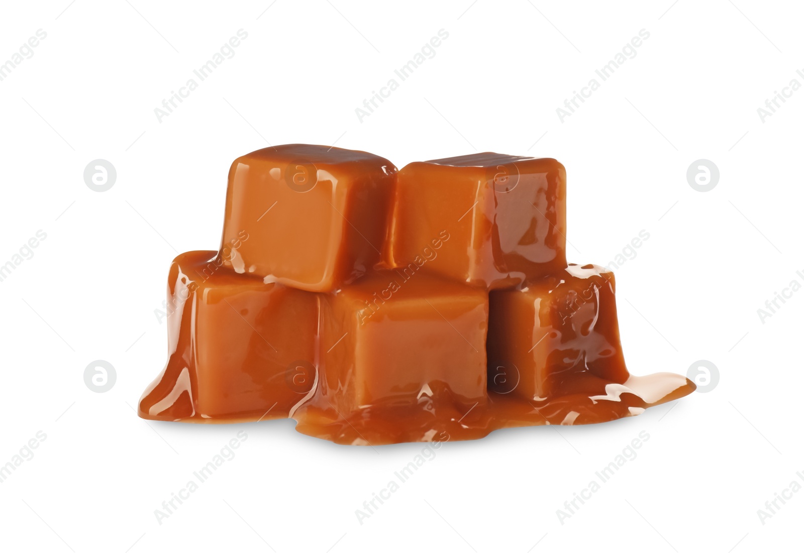 Photo of Caramel candies with topping on white background