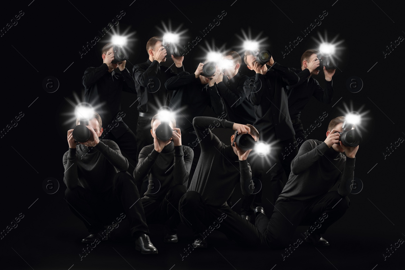 Image of Group of photographers with cameras on black background. Paparazzi