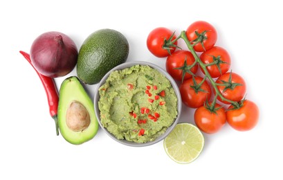 Bowl of delicious guacamole and ingredients isolated on white, top view