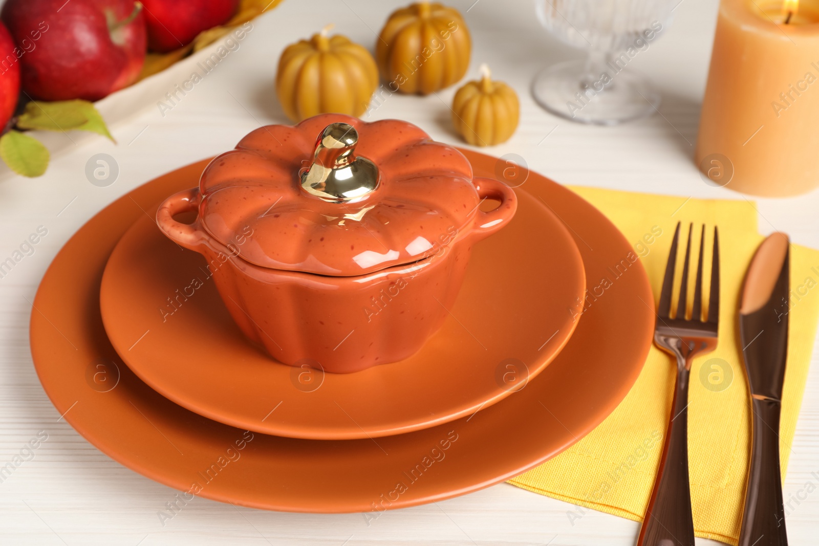 Photo of Beautiful autumn place setting with decor on white wooden table