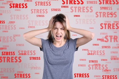 Image of Stressed young woman and text on light grey background