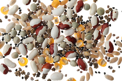 Mix of vegetable seeds on white background, top view