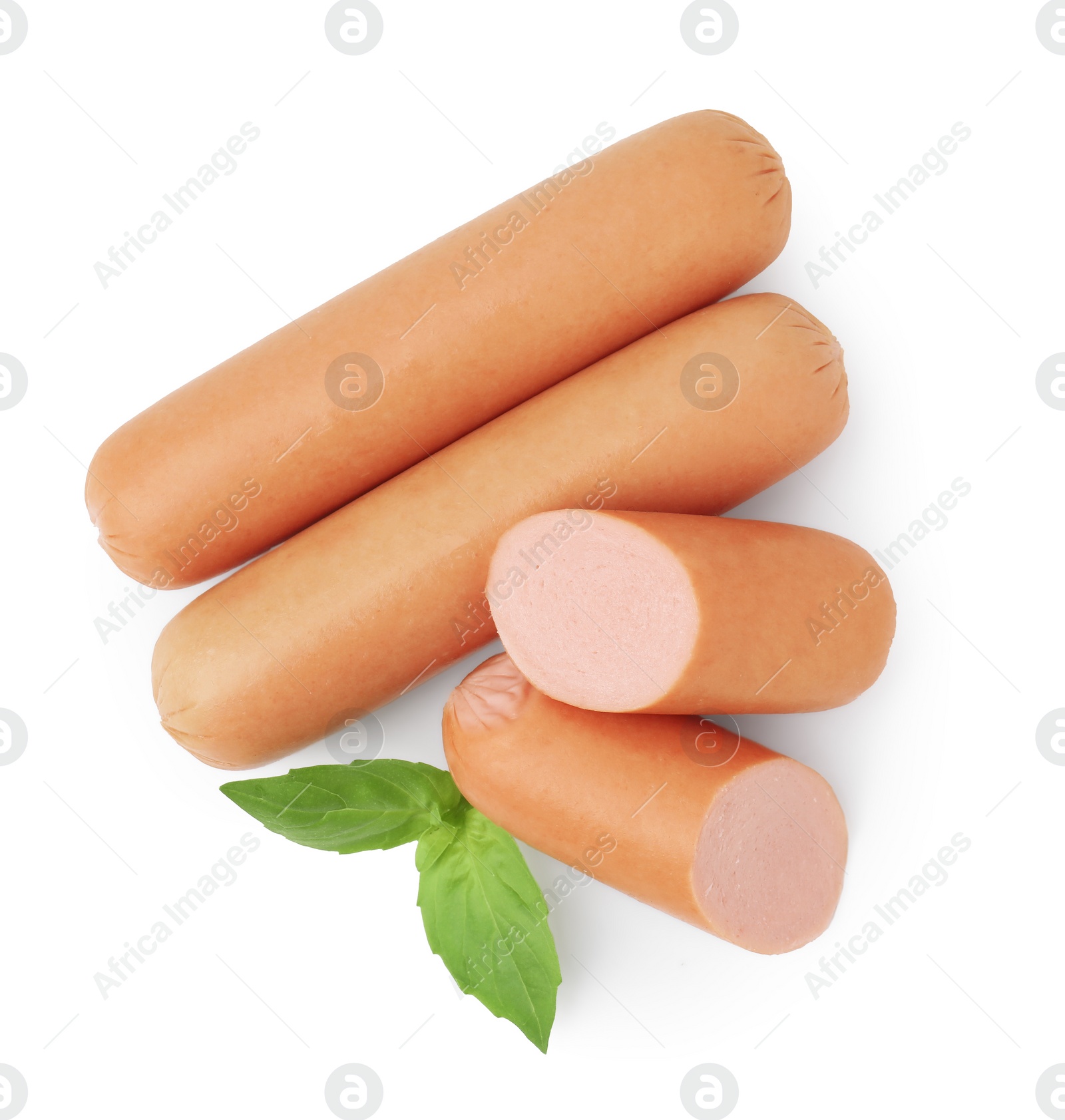 Photo of Whole and cut delicious boiled sausages with basil on white background, top view