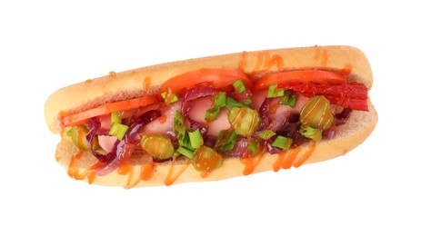 Photo of One tasty hot dog with green onion, tomato, pickles and sauce isolated on white, top view
