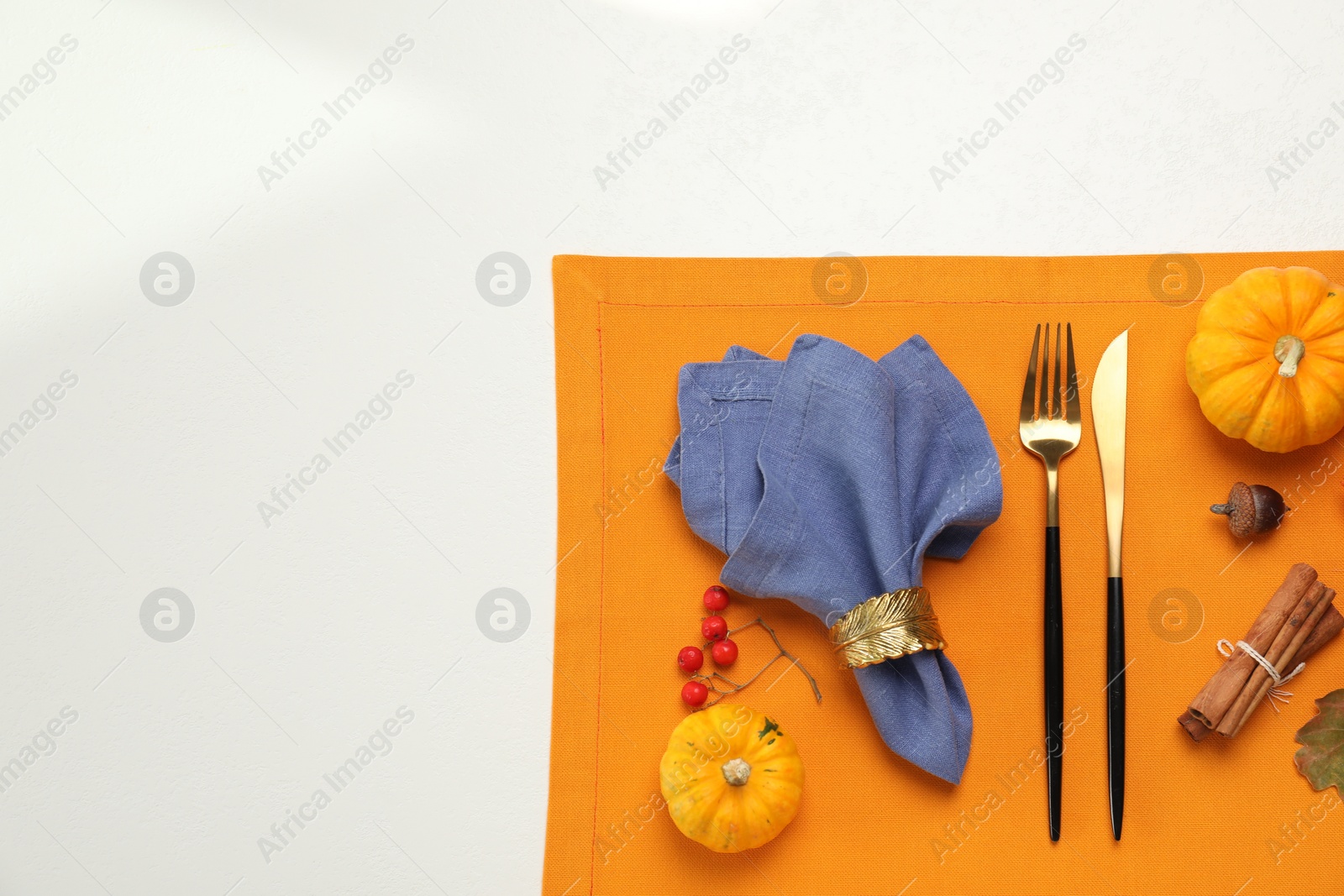 Photo of Flat lay composition with cutlery and napkins on white background, space for text. Table setting