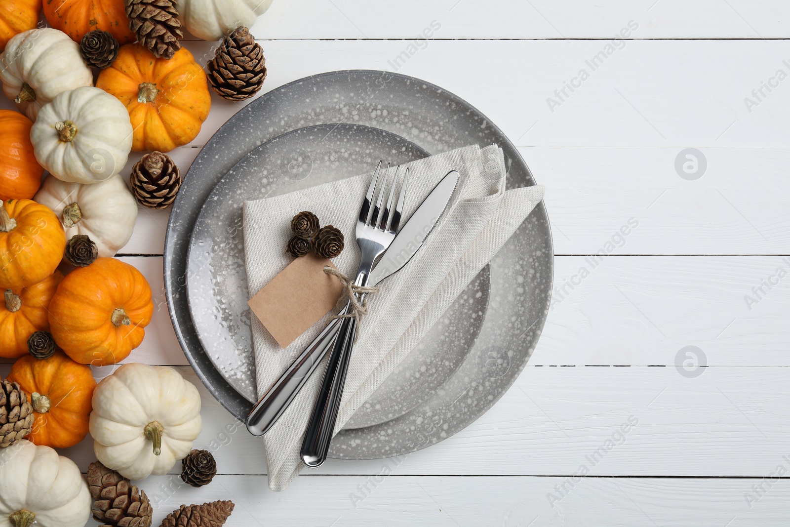 Photo of Thanksgiving day. Beautiful table setting and autumn decoration, flat lay. Space for text