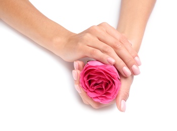 Photo of Woman holding rose on white background, closeup. Spa treatment