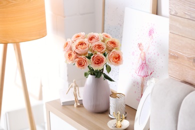 Photo of Vase with beautiful flowers on chest of drawers in modern room interior