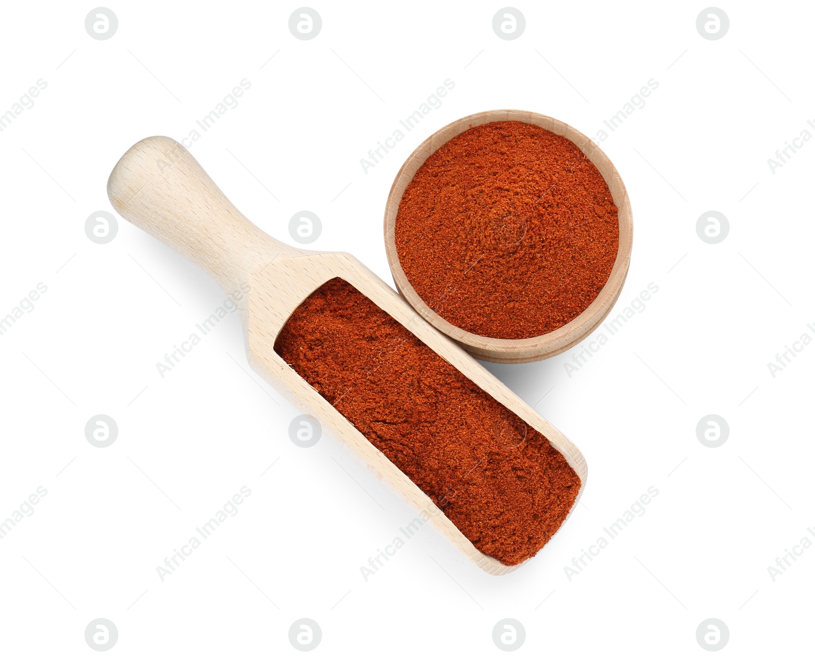 Photo of Scoop and bowl with aromatic paprika isolated on white, top view