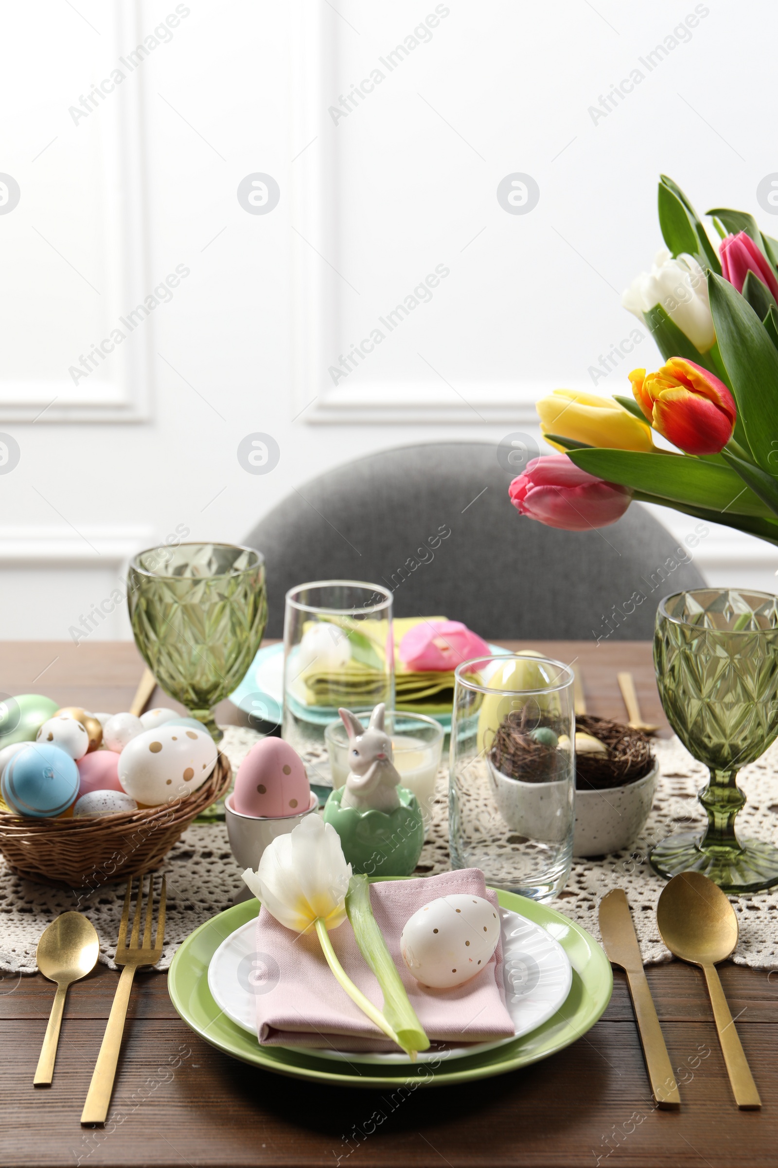 Photo of Festive table setting with beautiful flowers. Easter celebration